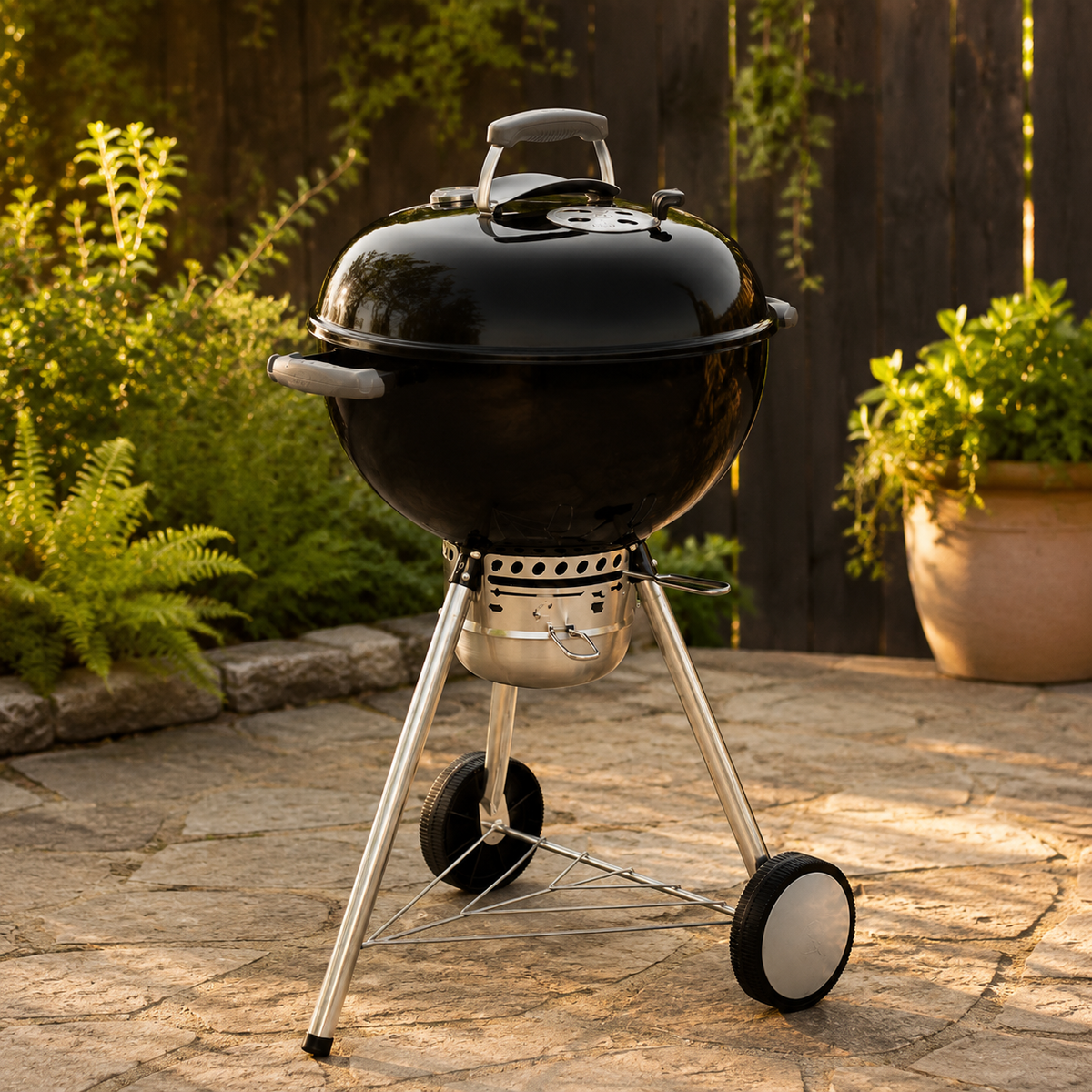 Black kettle charcoal grill outdoors